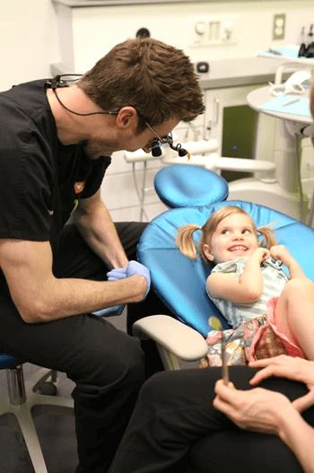 Pediatric dentist working with a toddler